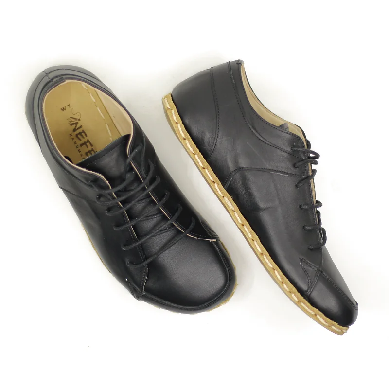 Men's hiking sneakers with a high - traction soleMen's Copper Rivet Earthing Leather Sneaker in Black